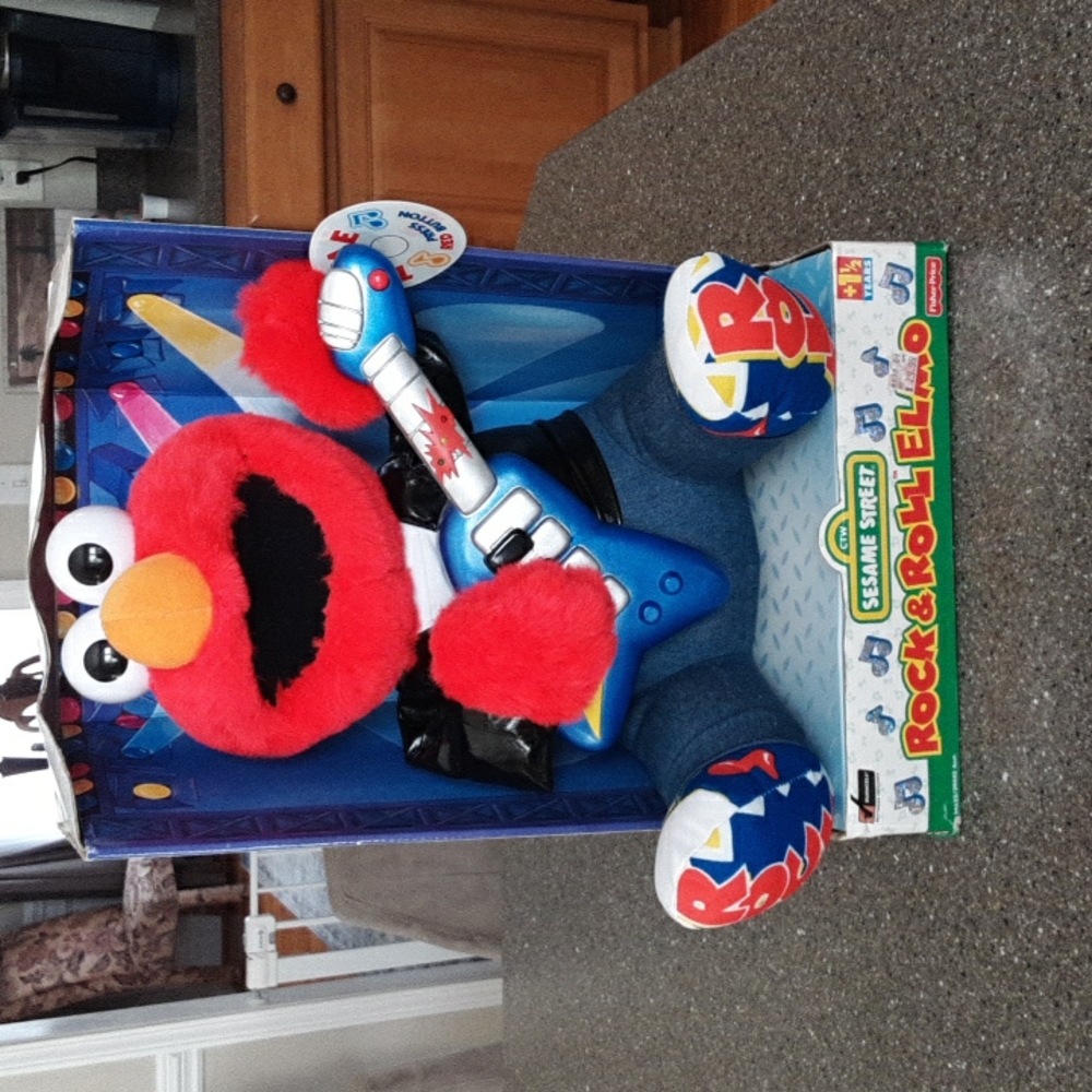 NWT VINTAGE ROCK N ROLL ELMO still in box.